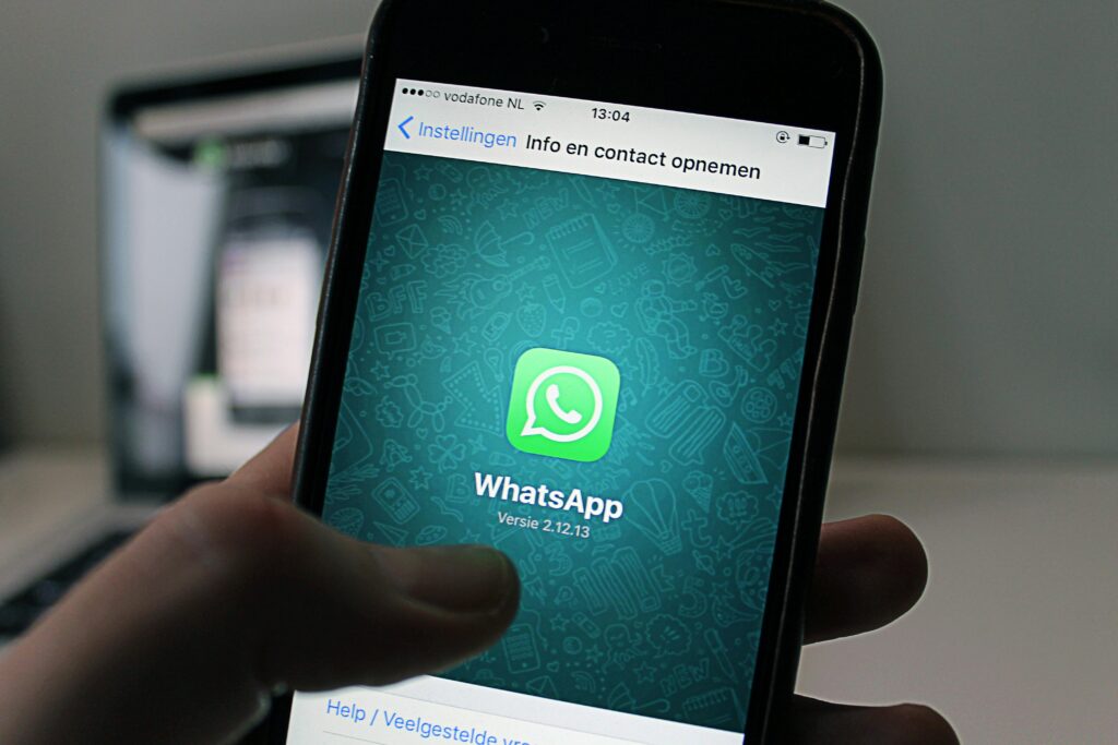 pexels-photo-46924-46924 A smartphone displaying the WhatsApp application screen held by a person.